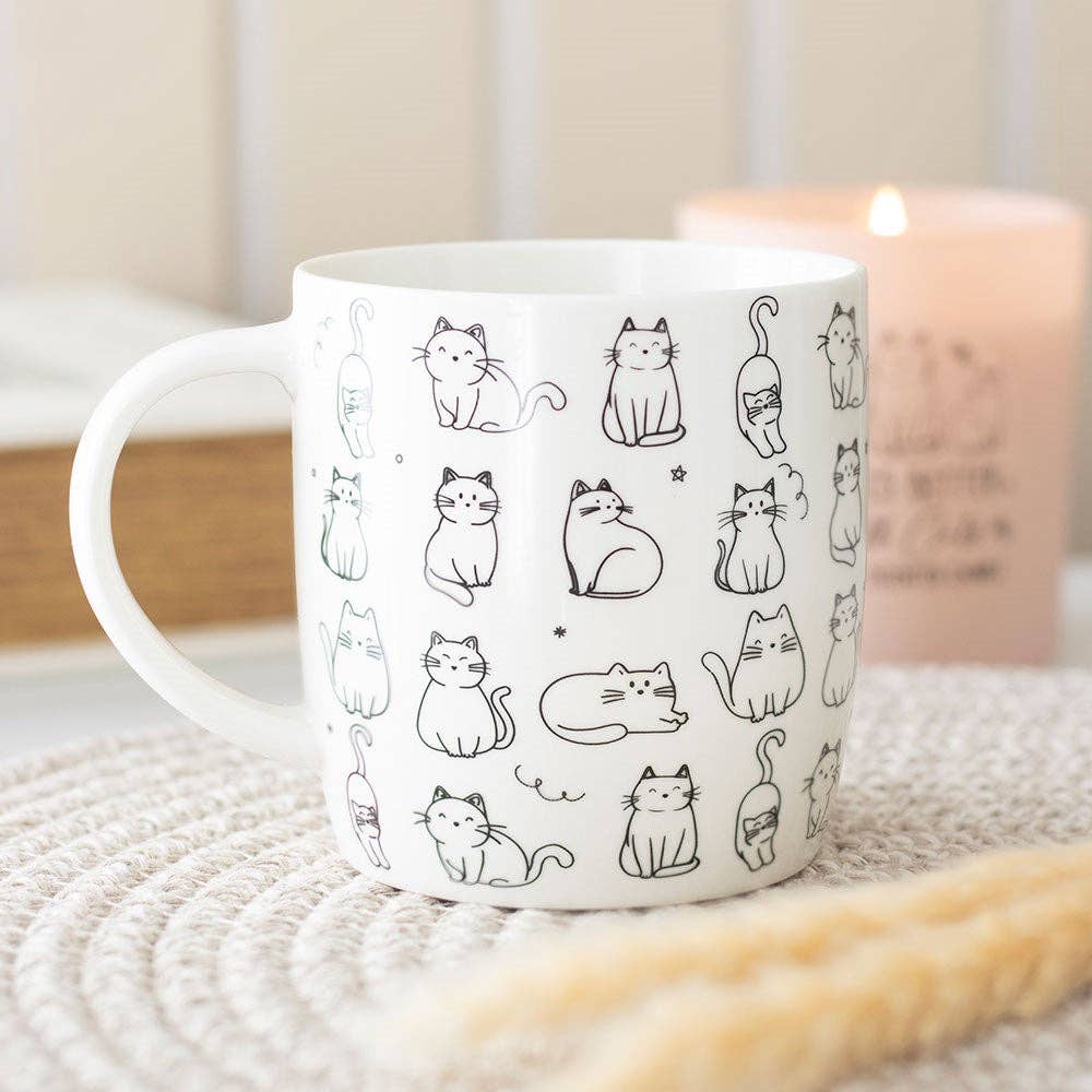 Witte mok met vrolijke kattenprint